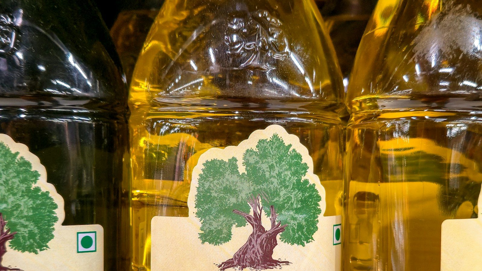 Bottles of extra virgin olive oil on a retail shelf