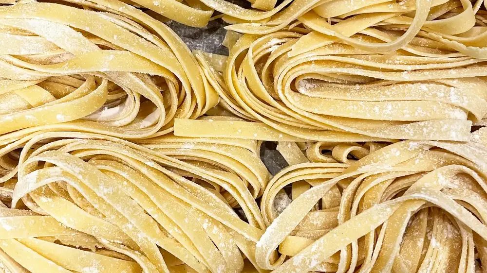 Italian durum wheat pasta on a production tray, supplied wholesale and in bulk