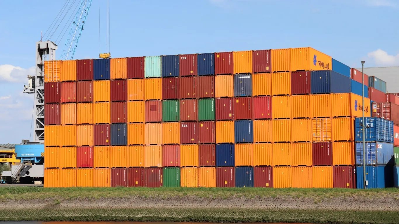 Shipping containers stacked at a northern European port handling Italian food imports